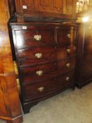 A mahogany 2 over 3 chest of drawers with drop handles.