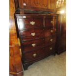 A mahogany 2 over 3 chest of drawers with drop handles.