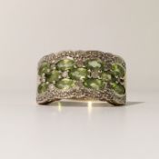 A 2 bar diamond with centre peridot's yellow gold ring, size P.