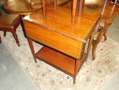 A Victorian satin wood table with tray and drawer.