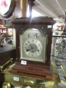 A mahogany mantel clock.