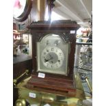 A mahogany mantel clock.