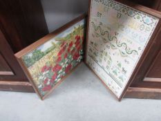 A framed and glazed 1989 sampler and a poppy field tapestry (glass a/f)