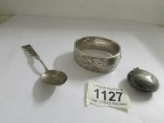 A hall marked silver bangle, an a/f silver sovereign case and a Rhodes silver commemorative spoon.