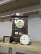 An old mantle clock and 2 smaller clocks.