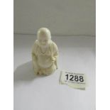 An ivory Buddha.