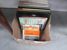 A box of 45 rpm and LP records.