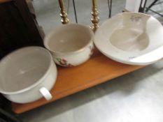 A bedpan and 2 chamber pots.