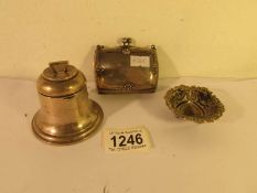 A silver dish, a silver inkwell and a silver purse.