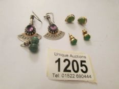 A pair of pendant earring in art deco style and 3 pairs of stud earring in various settings.