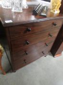 A mahogany 4 drawer chest.