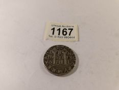 A 1738 Philip V Spanish silver cross 8 reales coin.