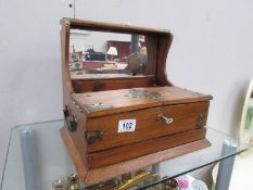 A tantalus box with key and secret compartment (no decanters).