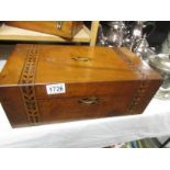 A mahogany inlaid writing box.