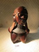 An African bust of a woman.