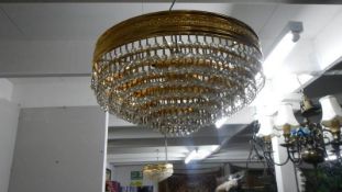 A modern gilt and brass ceiling light.