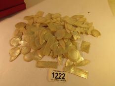 A large quantity of mother of pearl gaming counters,