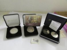 A 2005 Trafalgar silver proof coin, a Battle of Trafalgar £% and a Gibraltar Nelson coin.