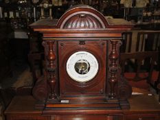 A Veranderlich aneroid barometer in ornate case.