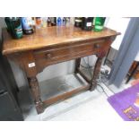 A good quality single drawer oak side table.