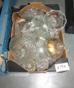 A box of assorted chandelier parts.