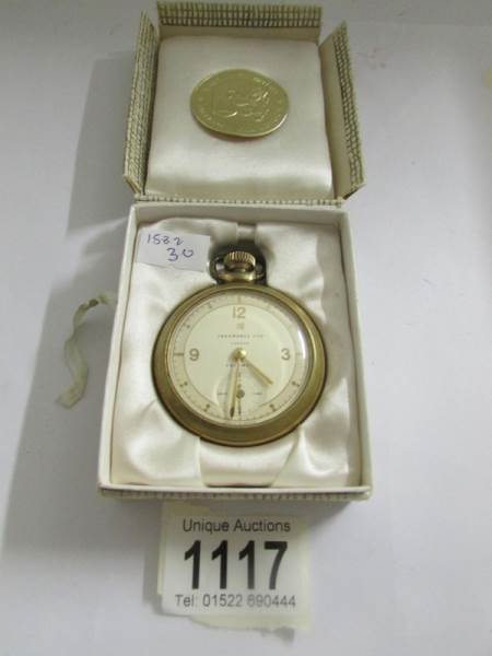 An Ingersol pocket watch in original box.