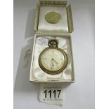 An Ingersol pocket watch in original box.