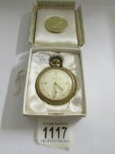 An Ingersol pocket watch in original box.