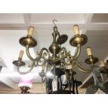 A 6 lamp brass ceiling light.