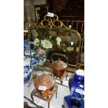 A Victorian brass fire screen with painted glass panels.