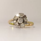 A circa 1960/70's cluster ring set with 6 diamonds stamped 18ct gold and platinum.