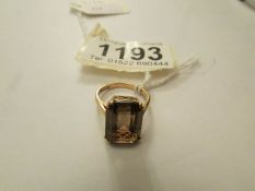 A 9ct gold ring set smoky quartz, size K.