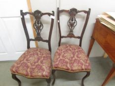 A pair of Edwardian chairs.