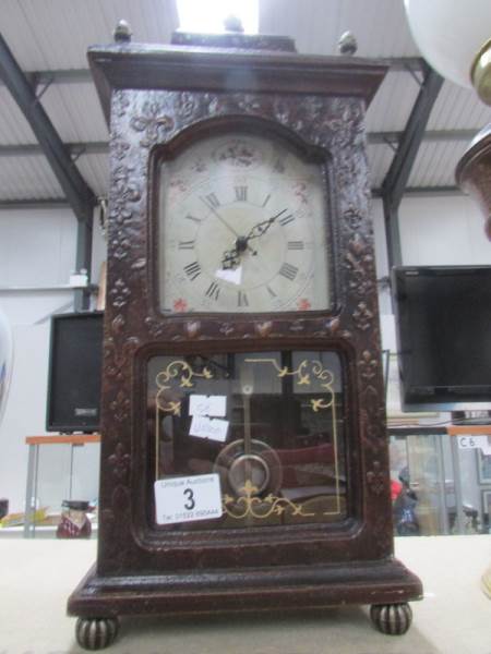 A mantel clock with battery movement.
