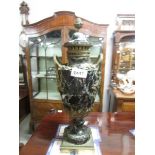 A marble and ormolu urn on stand.