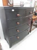 A 2 over 3 bow front chest of drawers.