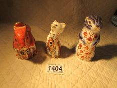 2 Royal Crown Derby Squirrels and a cat paperweights.