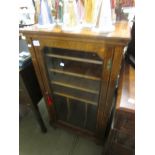 A rosewood cabinet with bone inlay.