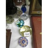 6 glass paperweights.