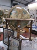 A globe shaped cocktail cabinet.