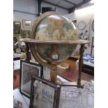 A globe shaped cocktail cabinet.