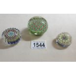 3 millifiori paperweights.