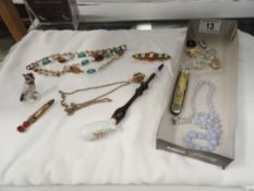 A mixed lot including jewellery, pipe etc.