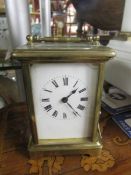 A brass carriage clock.