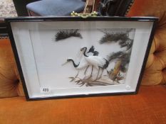 A framed collage of storks.