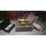 A Victorian magic lantern projector and 3 boxes of glass lantern slides,