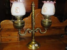 A double brass oil lamp.