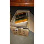 A box of books and car manuals.