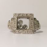 An unusual 14ct white gold and diamond ring, size P.