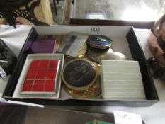 A quantity of vintage powder compacts.